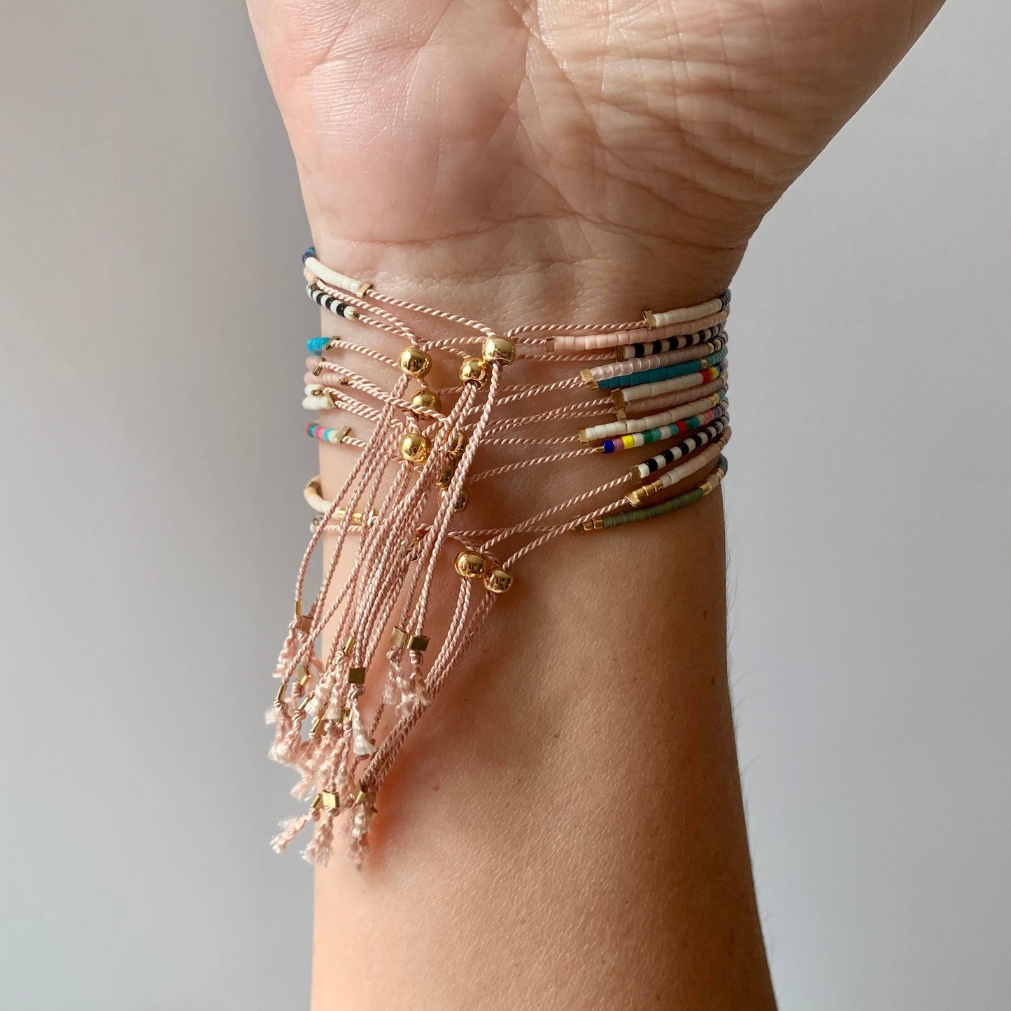 Handmade Adjustable Seed Bead String Bracelet
• Sunset Pink